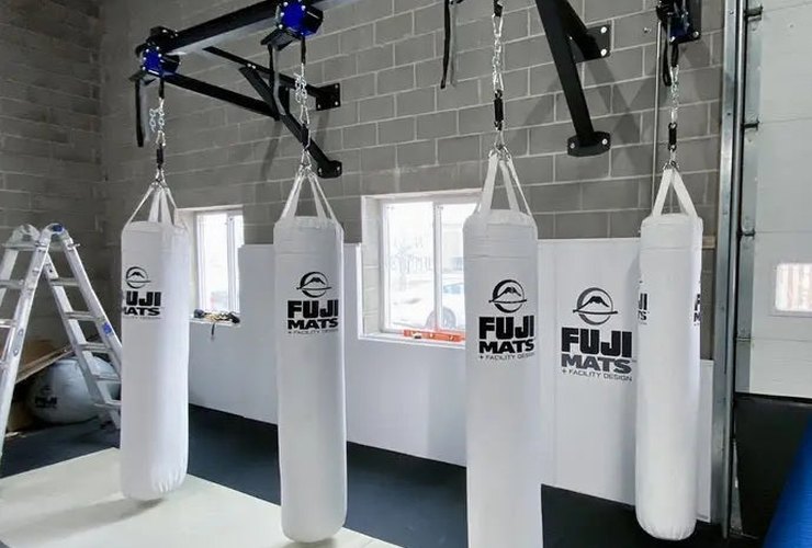 Fuji Mats wall-mount trolley bag rack with heavy bags (product photo; 3D designer coming soon)